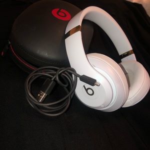 White and gold beats wireless over the ear